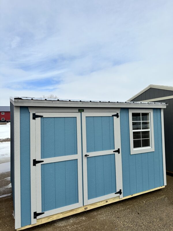 8x12 Premier Garden Shed Slate Blue Premier Cottage Shed (PCS) / Garden Shed (PGS) 75″ Rear Wall and 89″ Front Wall (Garden Shed Wall Heights Reversed). One 2’x3’ Window with Latch/Screen, 70” Door Opening & Double Wooden Doors, Door Lock and Keys, High-End Durable Hinges, Spring Latch Hooks Top and Bottom of Left Door Ensures Security.